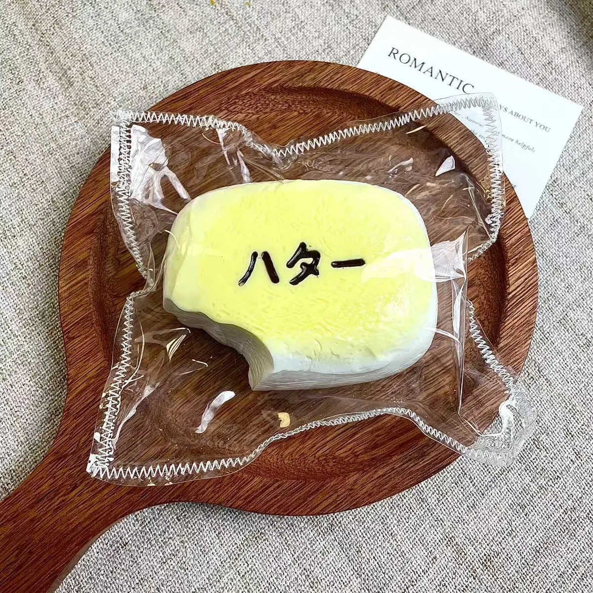 One-Bite Cheese Bread Squishy Toy - image 1
