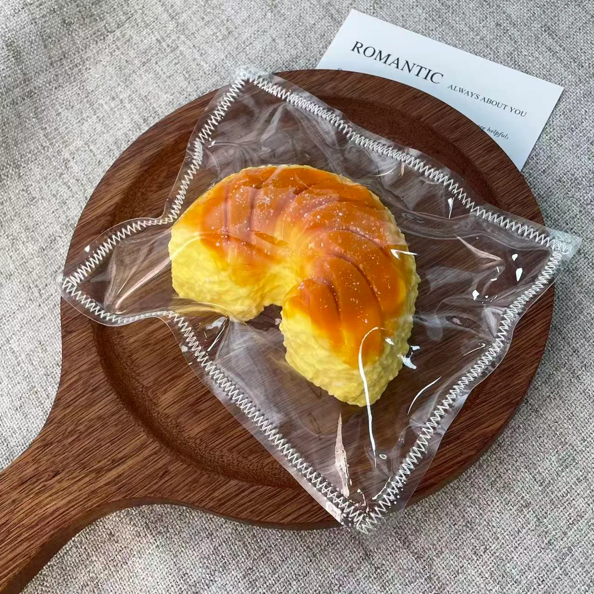 Half-Moon Baked Bread Squishy Toy - image 1
